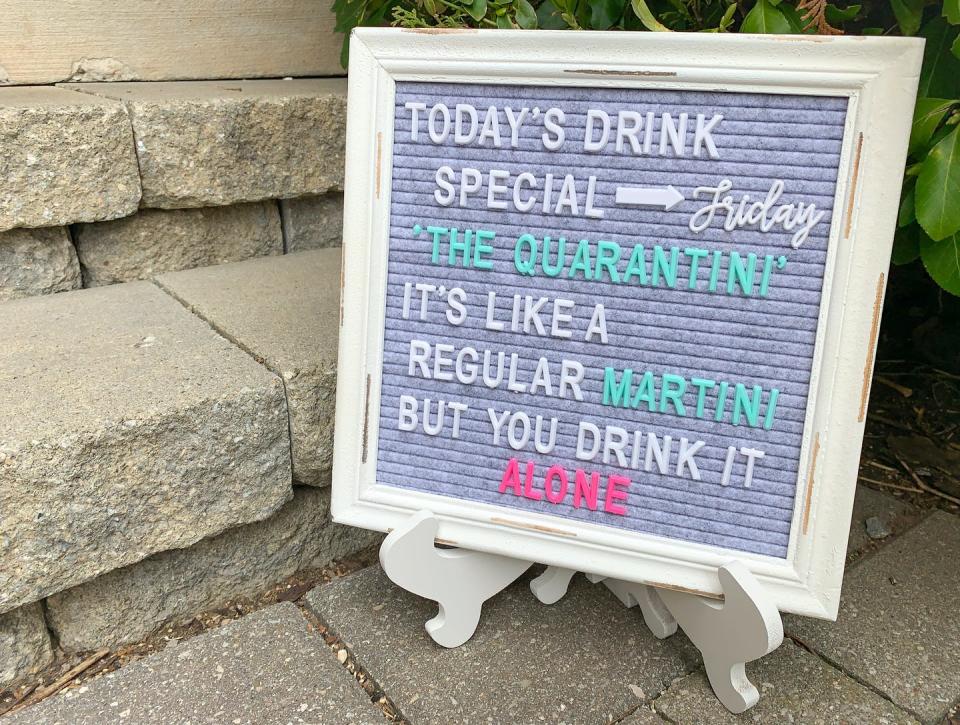 Sign that reads 'today's drink special is the quarantini, its like a regular martini but you drink it alone'