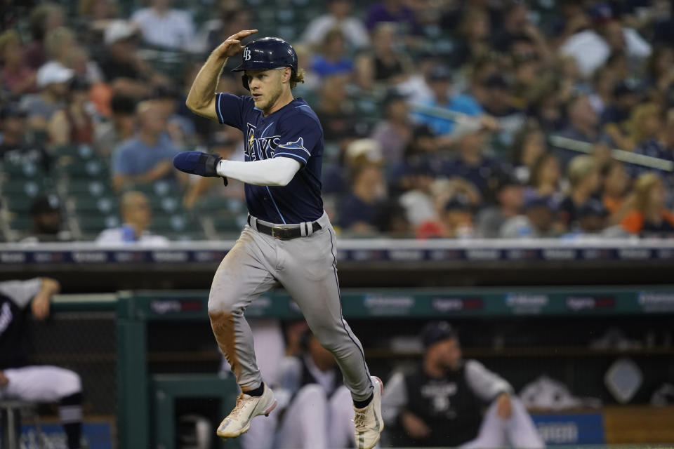 Tampa Bay Rays' Taylor Walls heads home to score on a double by designated hitter David Peralta during the fifth inning of a baseball game against the Detroit Tigers, Friday, Aug. 5, 2022, in Detroit. (AP Photo/Carlos Osorio)