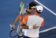 Tennis - Australian Open - Melbourne Park, Melbourne, Australia - 24/1/17 Switzerland's Roger Federer embraces after winning his Men's singles quarter-final match against Germany's Mischa Zverev. REUTERS/Jason Reed