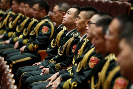 Military band members sit inside the Great Hall of the People during the ceremony to mark the 90th anniversary of the founding of the China's People's Liberation Army in Beijing, China August 1, 2017. REUTERS/Damir Sagolj