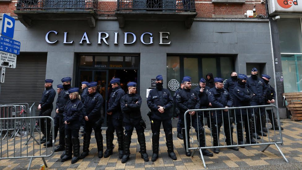 Police officers blocking the entrance to the event venue