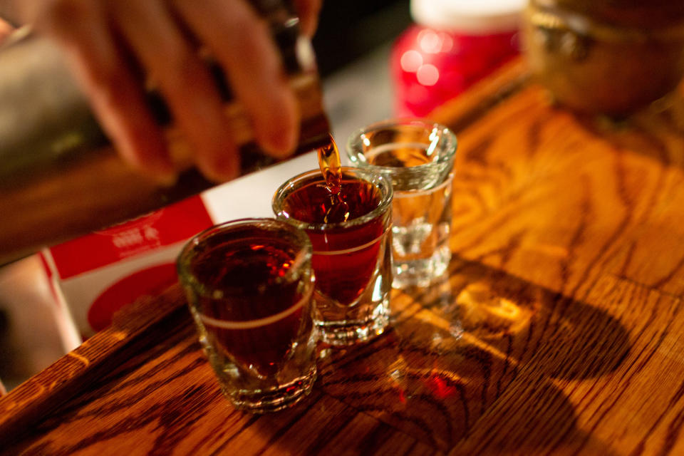 Bartender pouring shots