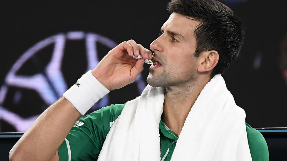 Novak Djokovic, pictured here taking some energy gels during the Australian Open final.