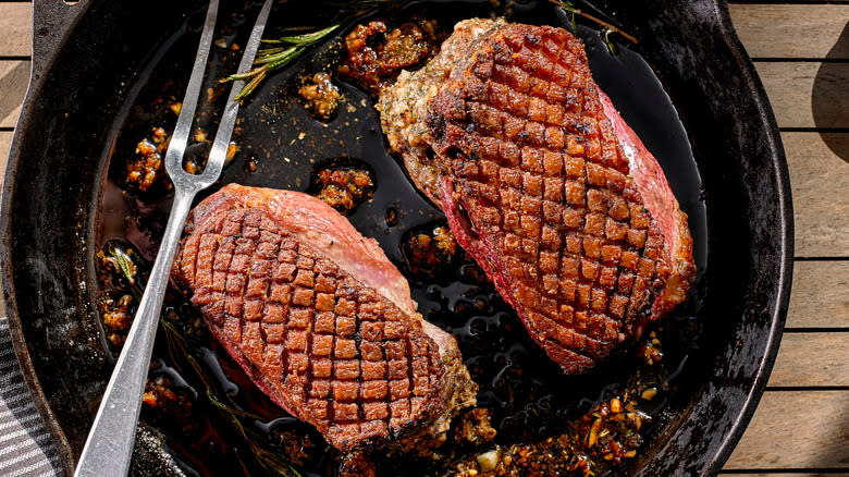 Crispy seared duck breast in cast-iron pan