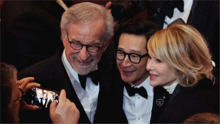 Ke Huy Quan, Kate Capshaw and Steven Spielberg gesture at the Oscars show at the 95th Academy Awards in Hollywood, Los Angeles, California, US, March 12, 2023
