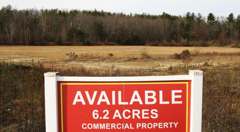 A sign marks commercial land for sale near Route 70 in Lancaster.