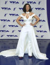 <p>The rapper, who performed her hit “Bodak Yellow” at the pre-show, wore a white jumpsuit with an attached train that was reminiscent of <a rel="nofollow" href="https://www.yahoo.com/style/michelle-obama-and-lady-gaga-have-something-in-162402420.html" data-ylk="slk:Lady Gaga’s Brandon Maxwell look at the Oscars;elm:context_link;itc:0;sec:content-canvas;outcm:mb_qualified_link;_E:mb_qualified_link;ct:story;" class="link  yahoo-link">Lady Gaga’s Brandon Maxwell look at the Oscars</a>. (Photo: AP) </p>