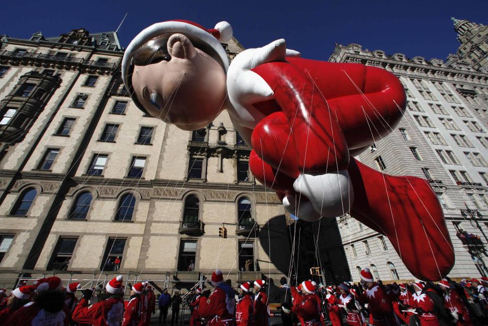 The Elf on a Shelf balloon floats down Central Park West during the 87th Macy's Thanksgiving Day Parade in New York