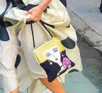 <p>The look was also accessorised with a playful bag. </p>