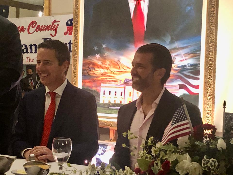 U.S. Senate candidate Bernie Moreno and Donald Trump Jr., the eldest son of former President Donald Trump, pose for pictures at Columbiana County Republican Party's annual Lincoln Day Dinner in Salem.
