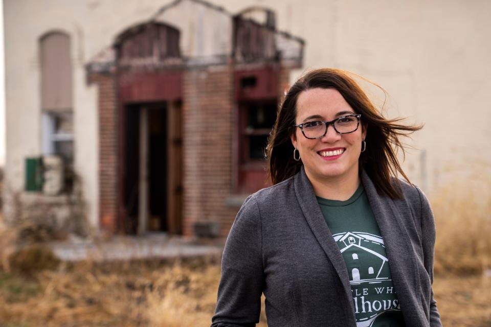 Megan Schmelzer stands outside the old Nagle School in Ankeny. She would like to see the Nagle building restored.
