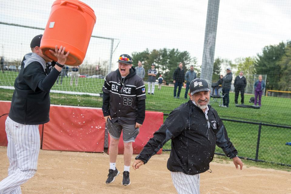 Bishop Eustace head coach Sam Tropiano, right, can't escape the cooler following a 5-3 win over Lenape, earning his 673rd win and a new South Jersey record Tuesday, April 16, 2019 at Lenape High School in Medford, N.J.
