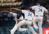June 16, 2018; Los Angeles, CA, USA; (Editors note: multiple exposure image) Los Angeles Dodgers relief pitcher Kenley Jansen (74) throws in the ninth inning against the San Francisco Giants at Dodger Stadium. Mandatory Credit: Gary A. Vasquez-USA TODAY Sports
