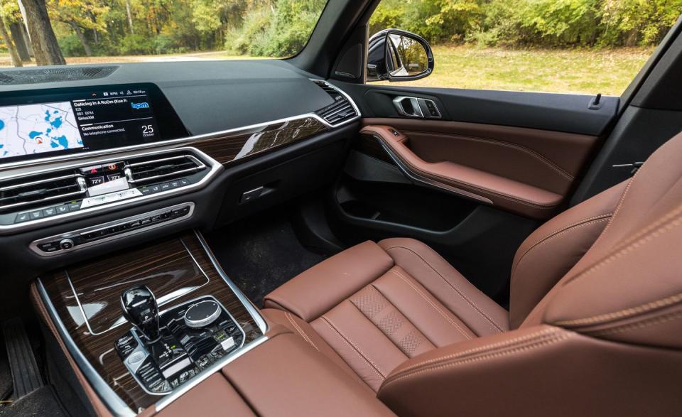<p>Optional finishes such as a leather-wrapped dash, glass controls, and no-cost open-pore wood class things up to a level that nearly matches the Volvo XC90's cabin, the segment's current posh interior of note.</p>