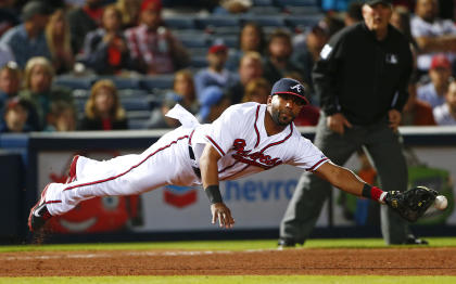 In this May 1, 2015, file photo, Alberto Callaspo reaches for a single during a Braves game. (AP)