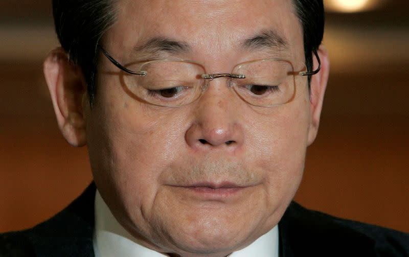 FILE PHOTO: Samsung Group Chairman Lee reacts during a news conference regarding his resignation at the company's headquarters in Seoul