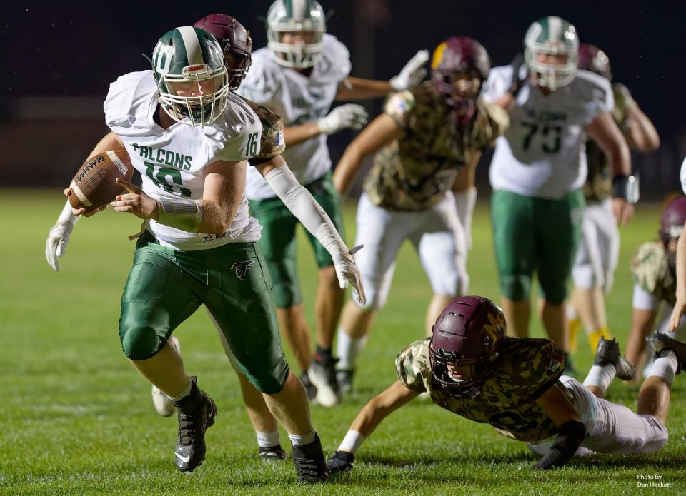 West Burlington–Notre Dame running back Hayden Vandenberg (16) carries the ball for a touchdown against Mount Pleasant Friday night.