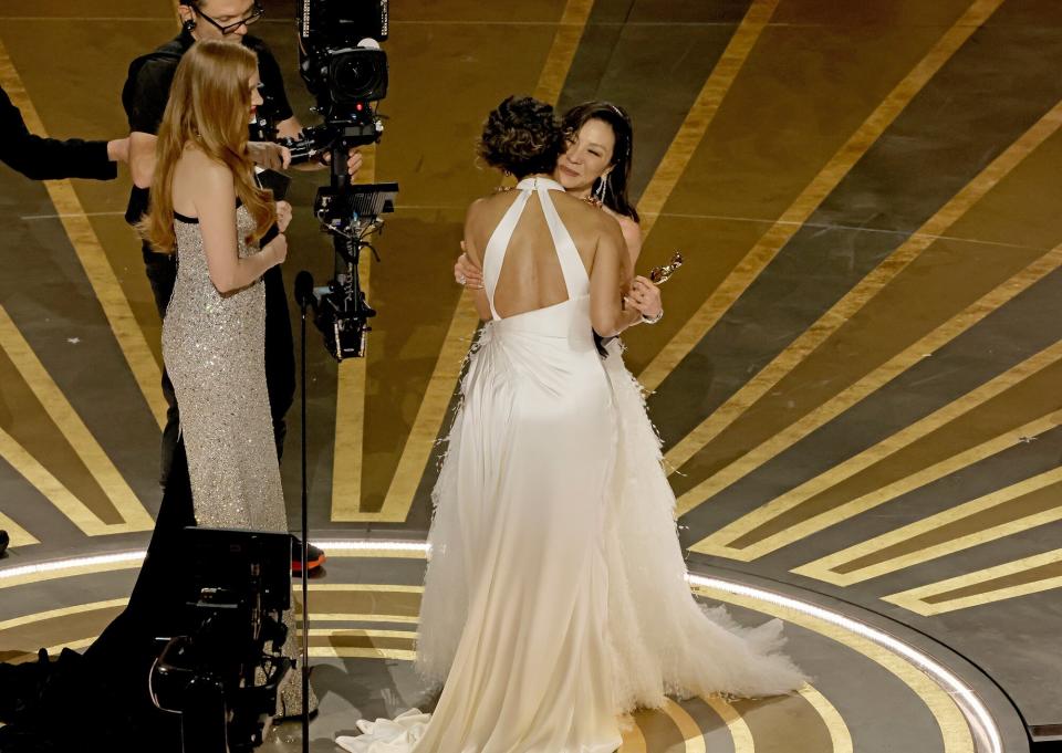 Michelle Yeoh accepts the Best Actress award for "Everything Everywhere All at Once" from Jessica Chastain and Halle Berry onstage during the 95th Annual Academy Awards at Dolby Theatre on March 12, 2023 in Hollywood, California.