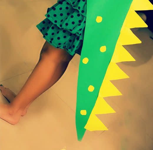 <p>A long bit of poster board can become a dinosaur hood or tail. This project is so easy (no sewing!), the trick-or-treater made a matching one for her stuffed animal.</p><p><em><a href="https://artsycraftsymom.com/easiest-diy-no-sew-dinosaur-costume-for-kids/" rel="nofollow noopener" target="_blank" data-ylk="slk:Get the tutorial at Artsy Craftsy Mom »;elm:context_link;itc:0;sec:content-canvas" class="link ">Get the tutorial at Artsy Craftsy Mom »</a> </em></p>