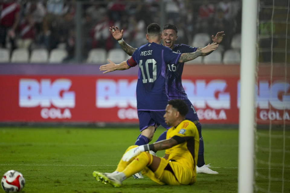 Argentina's Lionel Messi, 10, celebrates with teammate Enzo Fernandez after scoring his side's second goal against Peru during a qualifying soccer match for the FIFA World Cup 2026 at the National stadium in Lima, Peru, Tuesday, Oct. 17, 2023.(AP Photo/Martin Mejia)