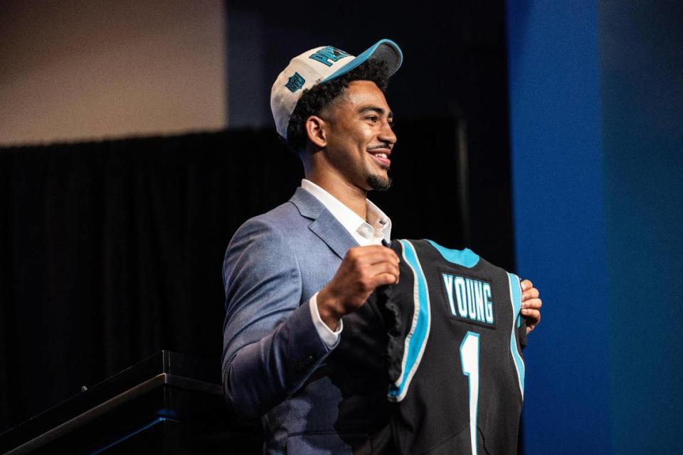 Carolina Panthers Bryce Young hold his jersey during a press conference at the Bank of America Stadium in Charlotte, N.C., on Friday, April 28, 2023.