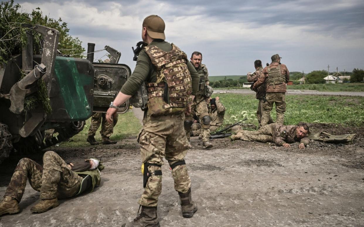 Ukrainian servicemen near the frontline in the eastern Ukrainian region of Donbas - AFP