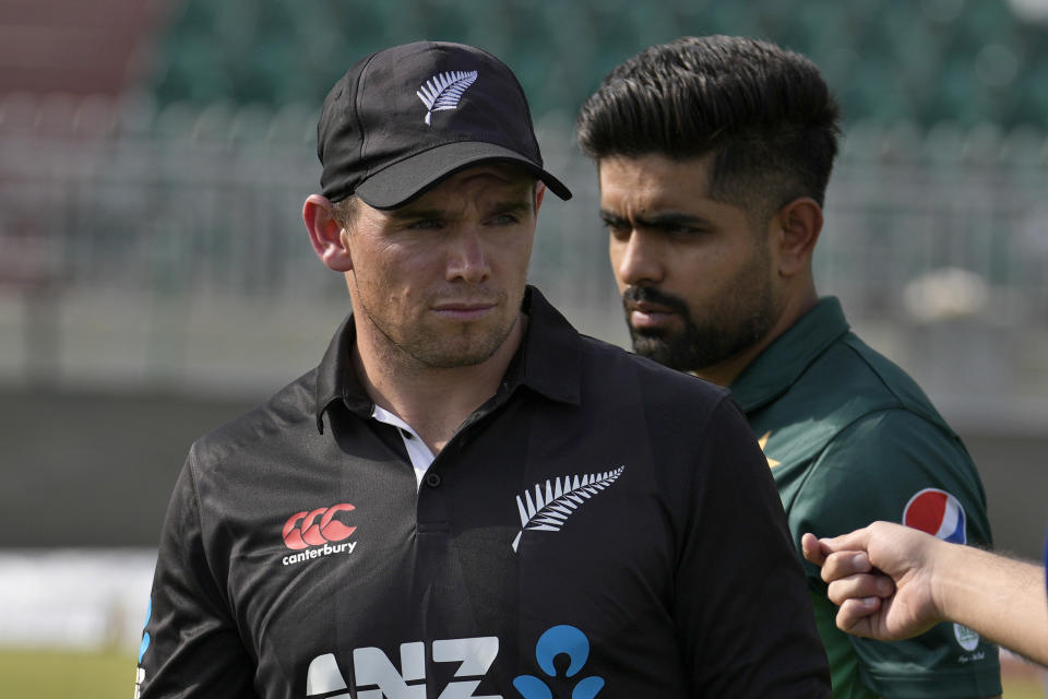 New Zealand's skipper Tom Latham, front, and with his Pakistani counterpart Babar Azam leave after a photograph with the trophy of one-day international cricket matches series, in Rawalpindi, Pakistan, Wednesday, April 26, 2023. (AP Photo/Anjum Naveed)