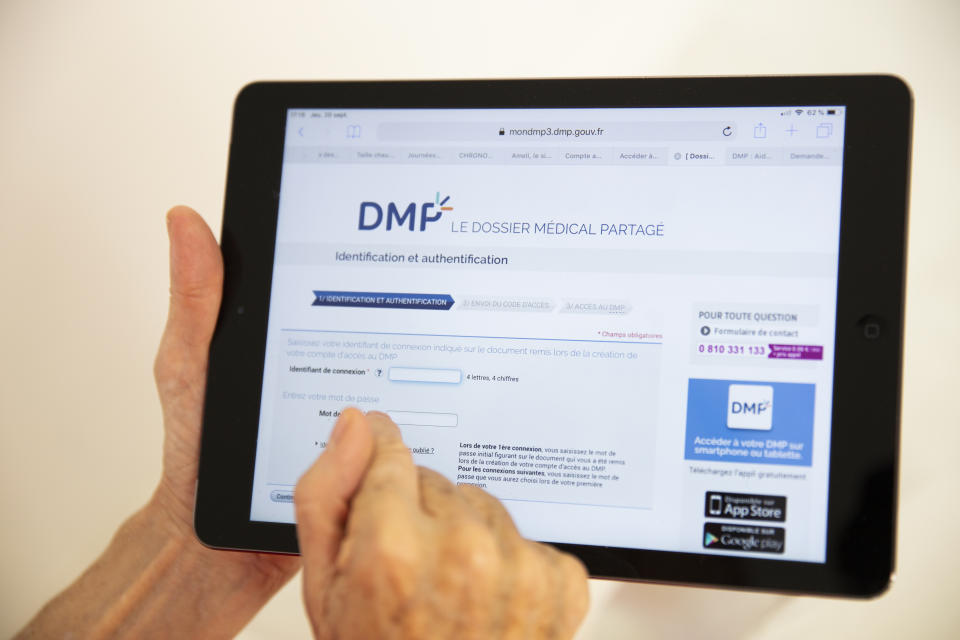 A woman looking at her shared medical records on a tablet. (Photo by: BSIP/Universal Images Group via Getty Images)