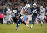 Oct 16, 2017; Nashville, TN, USA; Indianapolis Colts wide receiver Donte Moncrief (10) is tackled by Tennessee Titans linebacker Wesley Woodyard (59) at Nissan Stadium. The Titans defeated the Colts 36-22. Mandatory Credit: Kirby Lee-USA TODAY Sports