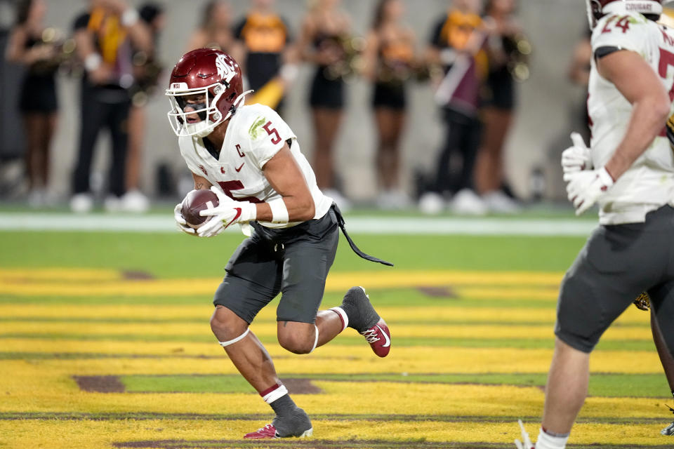 Washington State wide receiver Lincoln Victor (5) makes a touchdown catch against Arizona State during the first half of an NCAA college football game Saturday, Oct. 28, 2023, in Tempe, Ariz. (AP Photo/Ross D. Franklin)