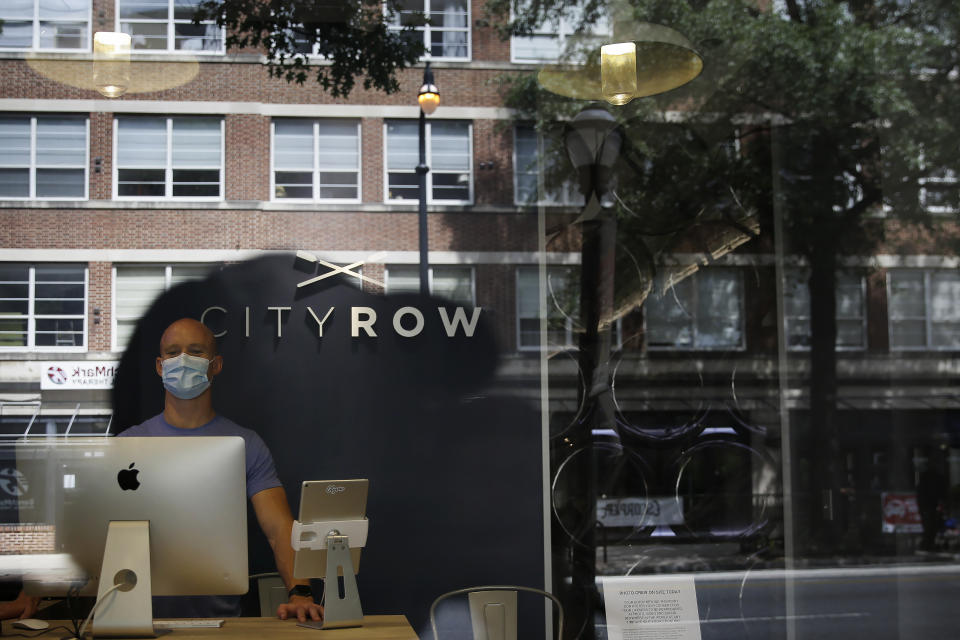 Co-owner, of CITYROW Atlanta Midtown, Josh Mumaw, 37, poses for a portrait as gyms reopen with limited members on Saturday, May 16, 2020, amid the COVID-19 virus in Atlanta. Big box gyms and local fitness studios are reopening under a patchwork of protocols based on state and local guidance, but most are following some basic protocol. (AP Photo/Brynn Anderson)