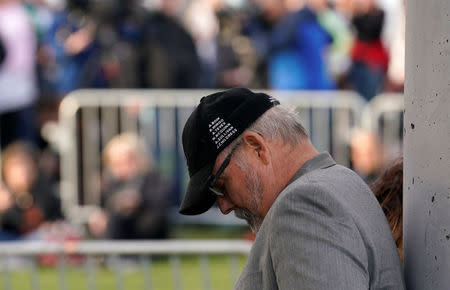 Tom Sullivan, father of Alex Sullivan, who was killed in the Aurora theater shooting, wears a cap with the names of the victims as teens kick off a voter registration rally, a day ahead of the 19th anniversary of the massacre at Columbine High School, in Littleton, Colorado, U.S., April 19, 2018. REUTERS/Rick Wilking