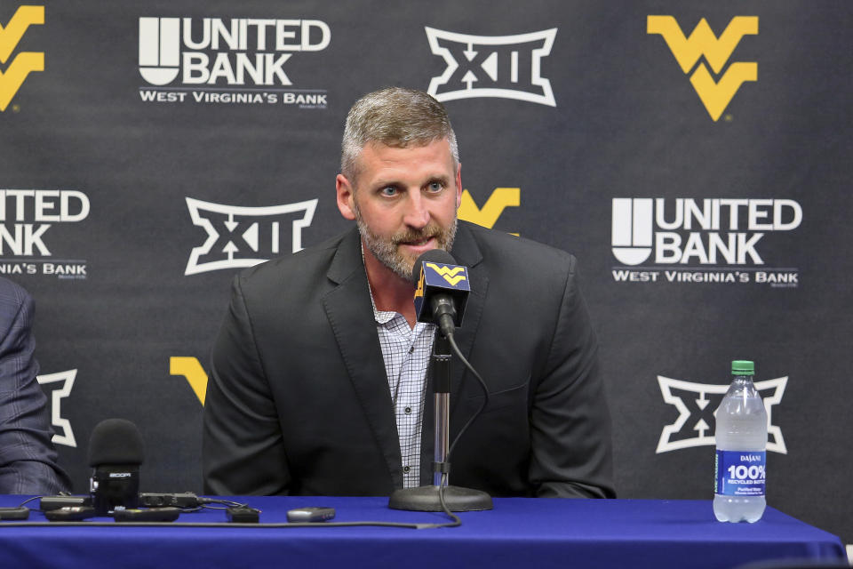 West Virginia interim NCAA college basketball coach Josh Eilert answers questions during a news conference, Monday, June 26, 2023, in Morgantown, W.Va. (AP Photo/Kathleen Batten)