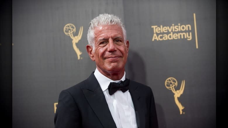 Anthony Bourdain smiles on the red carpet
