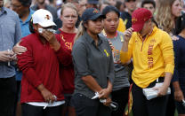 Iowa State golf team members react during a vigil for slain teammate Celia Barquin Arozamena, Wednesday, Sept. 19, 2018, in Ames, Iowa. Barquin, who was the 2018 Big 12 women's golf champion and Iowa State Female Athlete of the Year, was found Monday morning in a pond at a golf course near the Iowa State campus. (AP Photo/Charlie Neibergall)