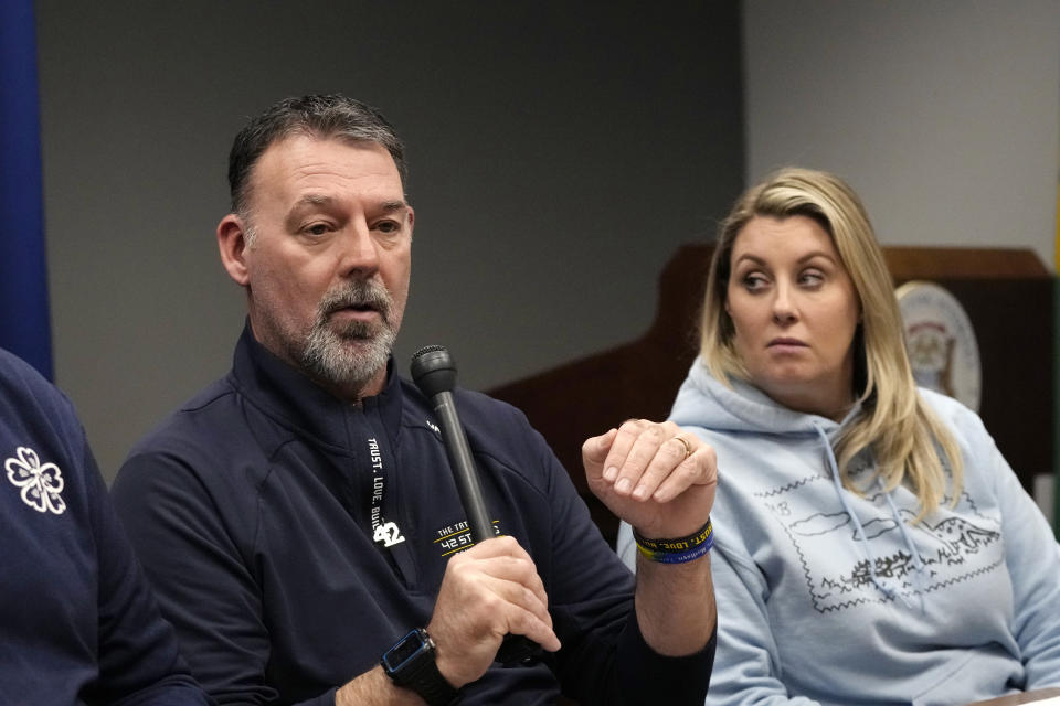 Nicole Beausoleil, right, the parent of Oxford H.S. School shooting victim Madisyn Baldwin looks towards Buck Myre, father of Tate Myre during an interview, Monday, March 18, 2024 in Pontiac, Mich. The parents of four students killed at a Michigan school called for a state investigation of all aspects of the 2021 mass shooting, saying a local criminal probe that netted three is not enough to close the book. (AP Photo/Carlos Osorio)