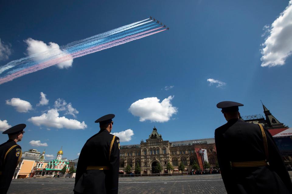 Russian Air Force Su-25 jets fly over Red Square leaving trails of smoke in colors of national flag during the Victory Day military parade in Moscow, Russia, in 2020.