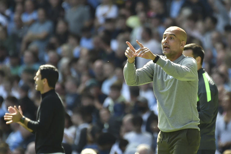 Manchester City's head coach Pep Guardiola gestures during the English Premier League soccer match between Manchester City and Arsenal at Etihad stadium in Manchester, England, Saturday, Aug. 28, 2021. (AP Photo/Rui Vieira)
