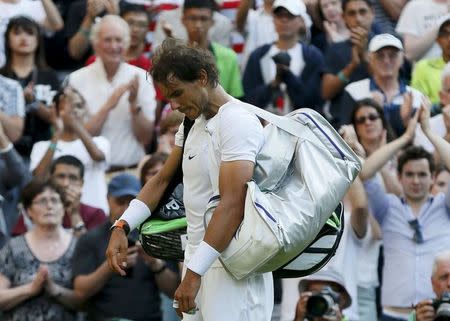 Rafael Nadal of Spain prepares to walk off court after losing his match against Dustin Brown of Germany at the Wimbledon Tennis Championships in London, July 2, 2015. REUTERS/Stefan Wermuth