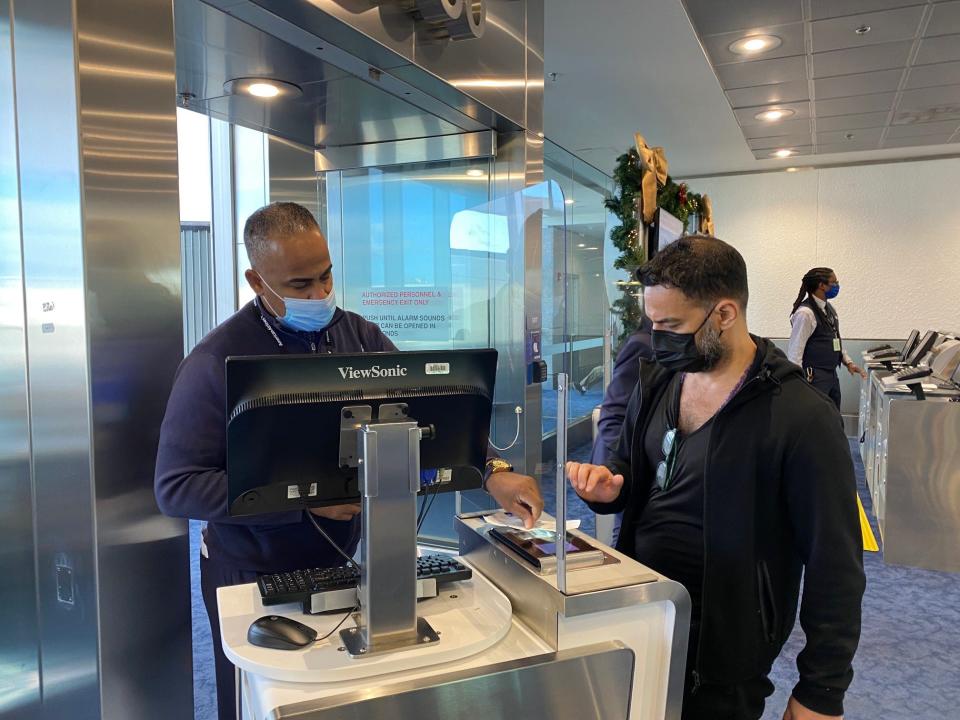 Checking boarding passes before the flight.