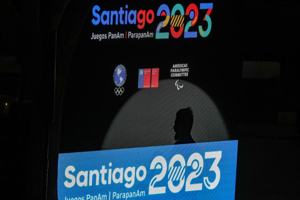 FILE - A shadow of the Chile's President Gabriel Boric is seen on screen during a 2023 Pan Am Games ceremony at the Santa Lucia Hill, in Santiago, Chile, Sept. 30, 2023. The Pan American Games will be held in Chile from Oct. 20. to Nov 5. (AP Photo/Esteban Felix, File)