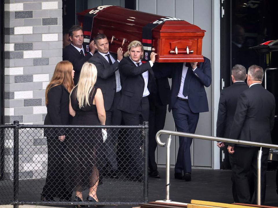 Shane Warne's coffin, pictured here being carried by his son Jackson and others after a private memorial service at the St Kilda Football Club.