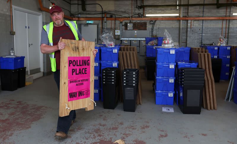 A worker prepares to deliver election ballot boxes in Edinburgh, Scotland