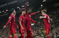 Liverpool's Divock Origi, center, celebrates scoring their side's second goal of the game with team-mates during the English League Cup third round soccer match at Carrow Road, Norwich, England, Tuesday Sept. 21, 2021. (Joe Giddens/PA via AP)