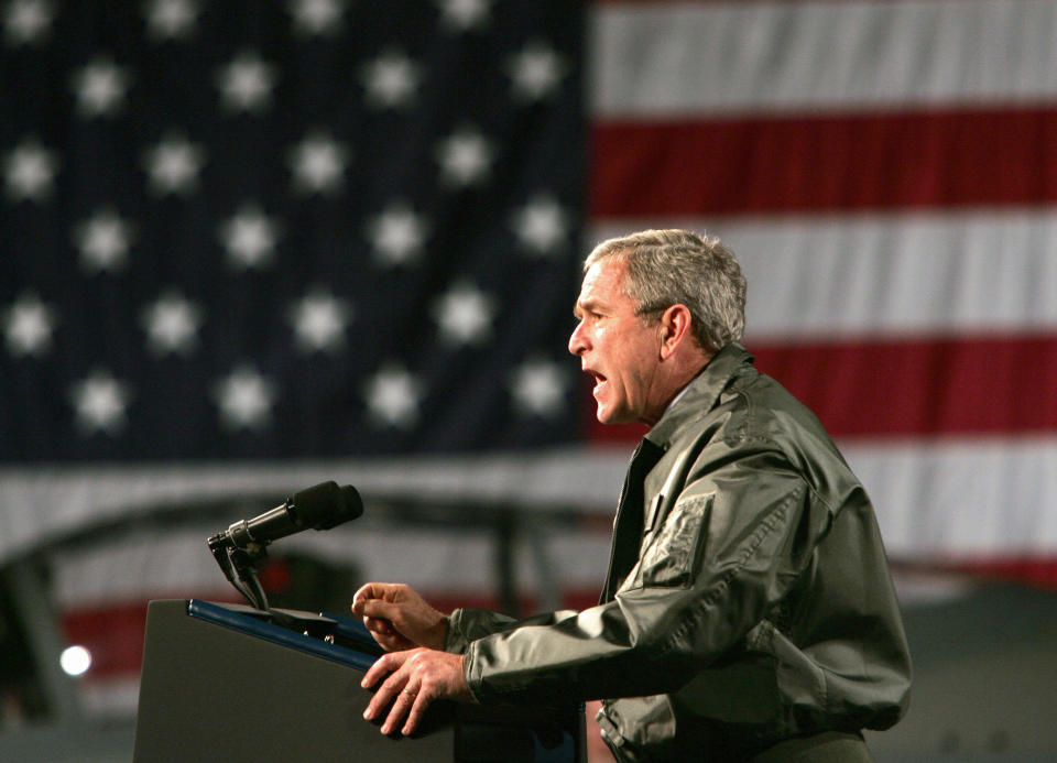 President George W. Bush presided over the beginning of the global war on terror. He used Congress' 2001 authorization to justify military actions or deployments in 12 countries. (Photo: PAUL J. RICHARDS via Getty Images)