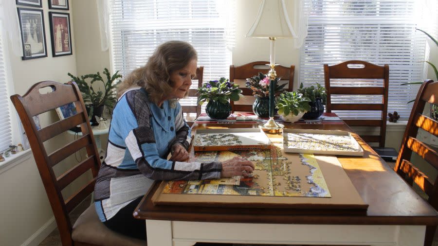 Barbara Lillis working on a puzzle