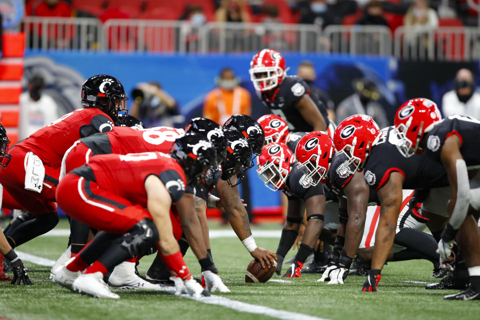 ATLANTA, GA - JANUARY 01: Desmond Ridder #9 of the Cincinnati Bearcats lines up under center during the first half of the Chick-fil-A Peach Bowl against the Georgia Bulldogs at Mercedes-Benz Stadium on January 1, 2021 in Atlanta, Georgia. (Photo by Todd Kirkland/Getty Images)