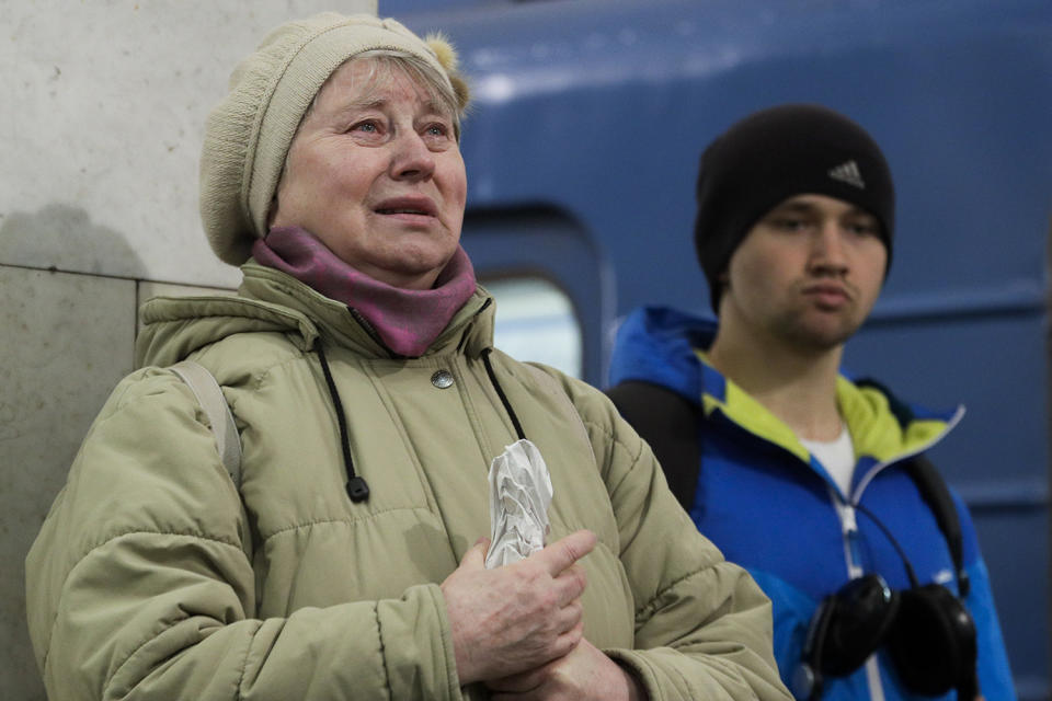 Woman crying at metro station