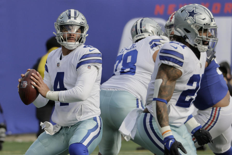 Dallas Cowboys quarterback Dak Prescott (4) looks to pass against the New York Giants during the first quarter of an NFL football game, Sunday, Dec. 19, 2021, in East Rutherford, N.J. (AP Photo/Corey Sipkin)