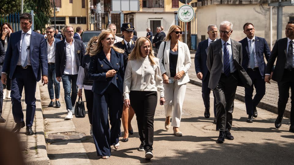 Giorgia Meloni, center, walks in Caivano on August 31, 2023. Her visit was prompted by concerns over drug use and crime in the town, including the alleged rape of two girls by a group of boys. - Ivan Romano/Getty Images